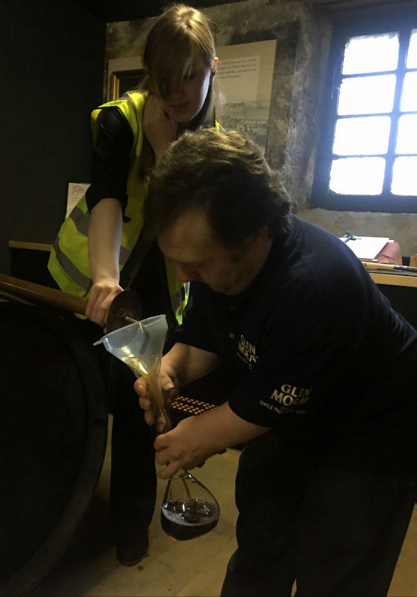 Anders filling his bottle at Glengarioch distillery Scotland