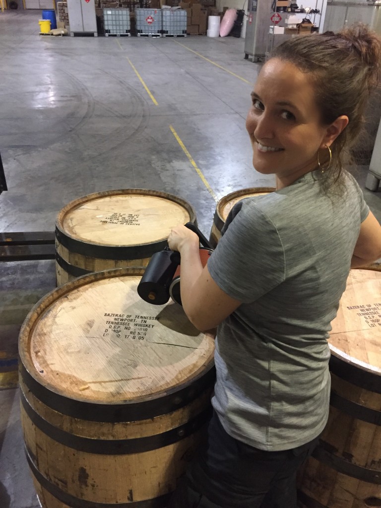 Distiller Allisa Henley stamping barrels